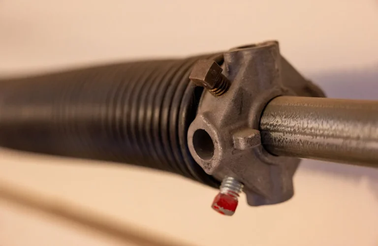 homeguide-close-up-of-garage-door-torsion-spring-coiled-up-1